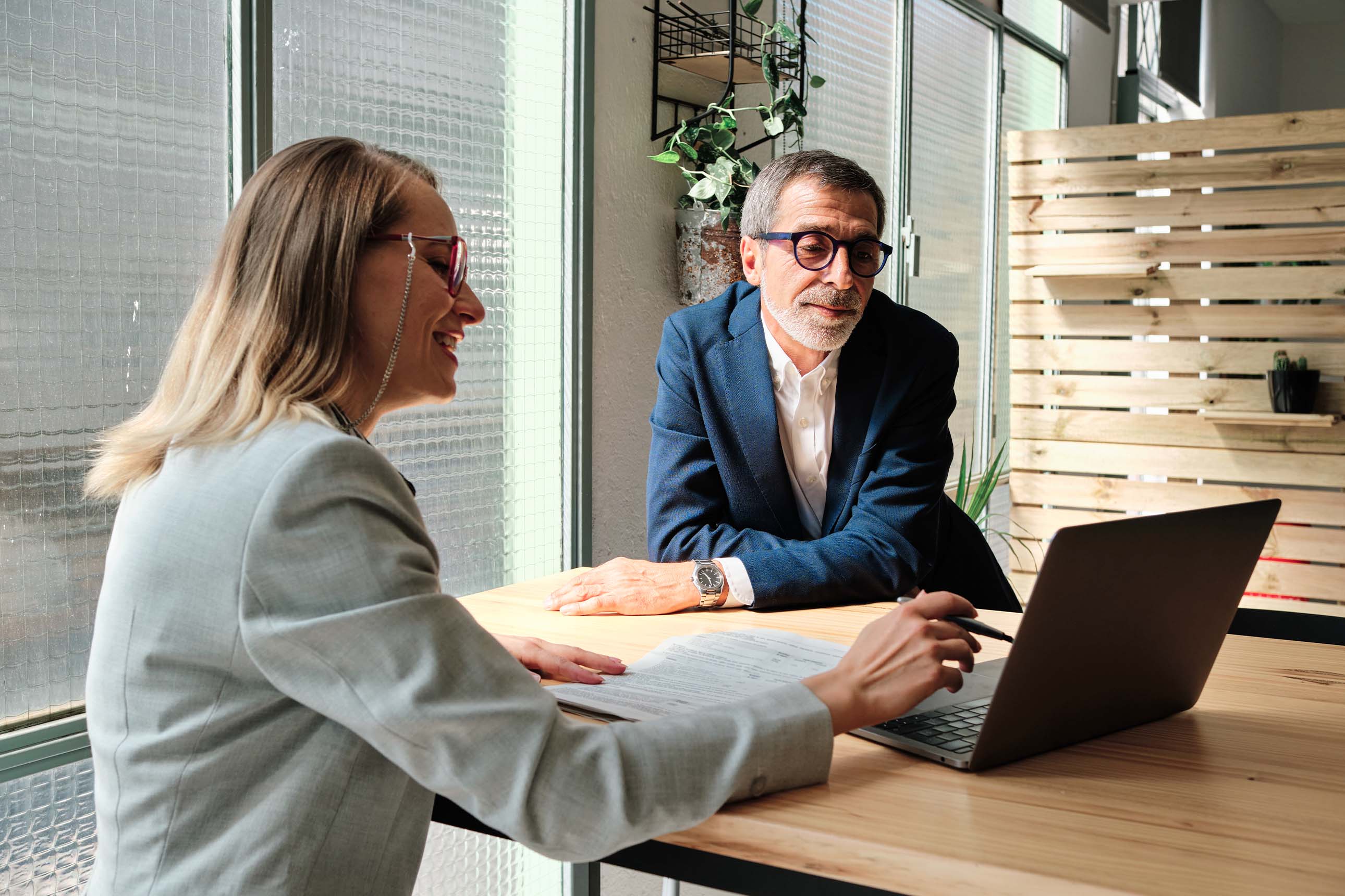 Professionals reviewing documents during a consultation